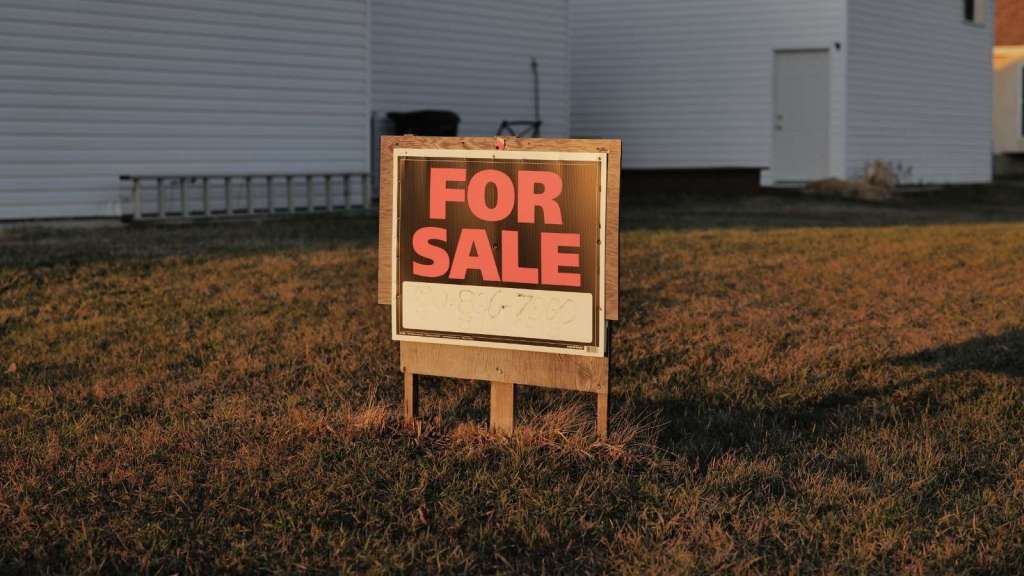 for sale sign in front yard