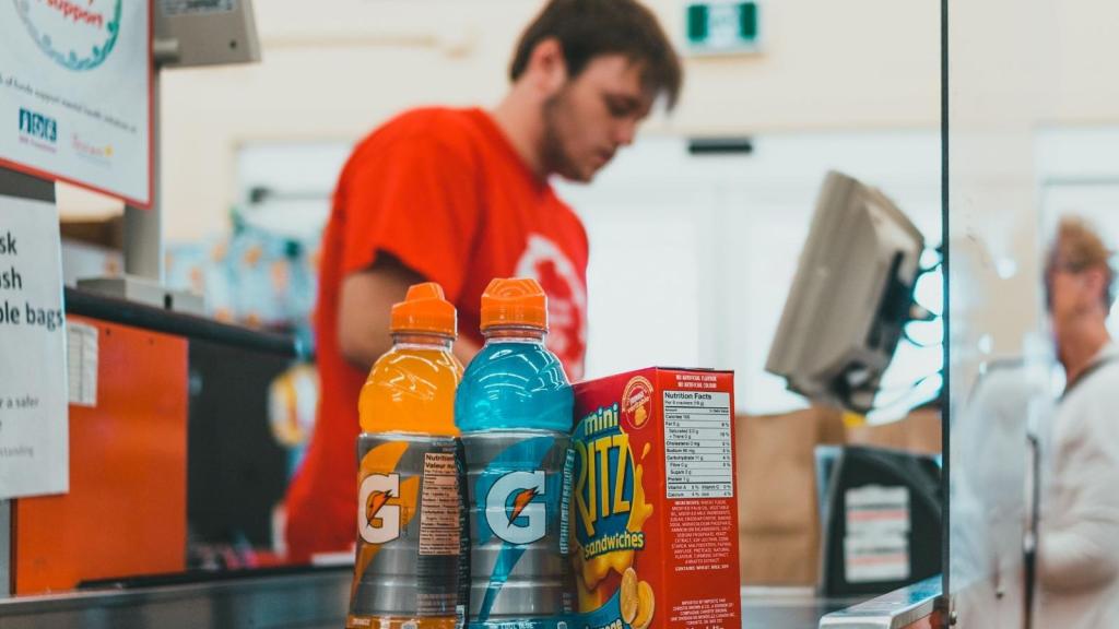 grocery store employee scanning items
