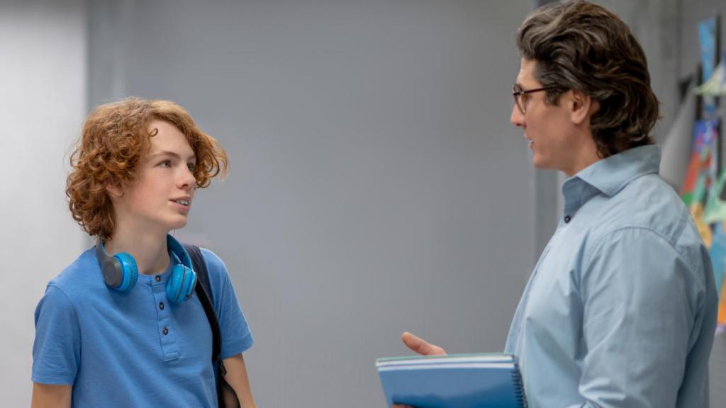 teacher talking to a student