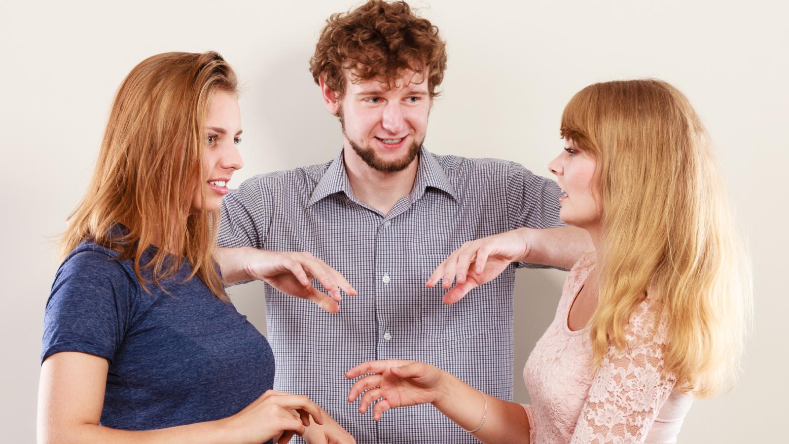man with two women