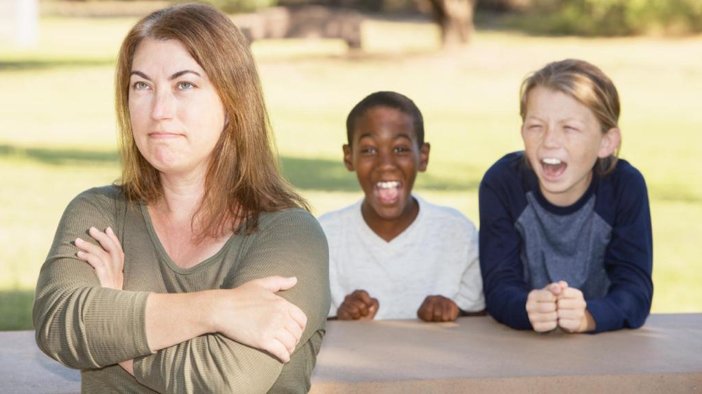 woman with kids yelling at her