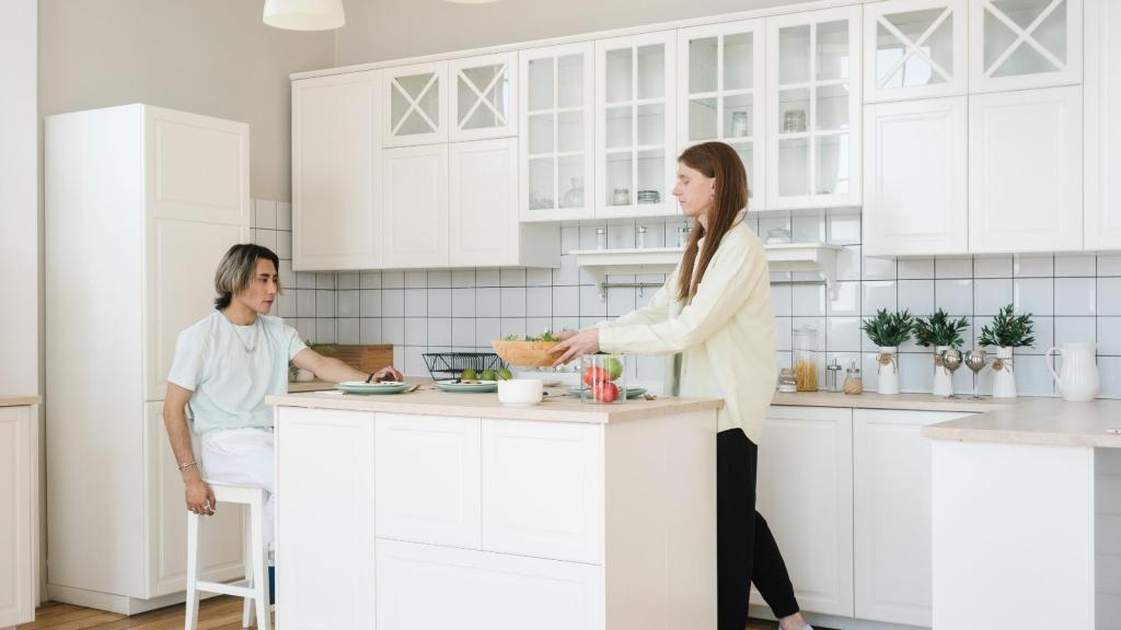 man and woman cooking in kitchen