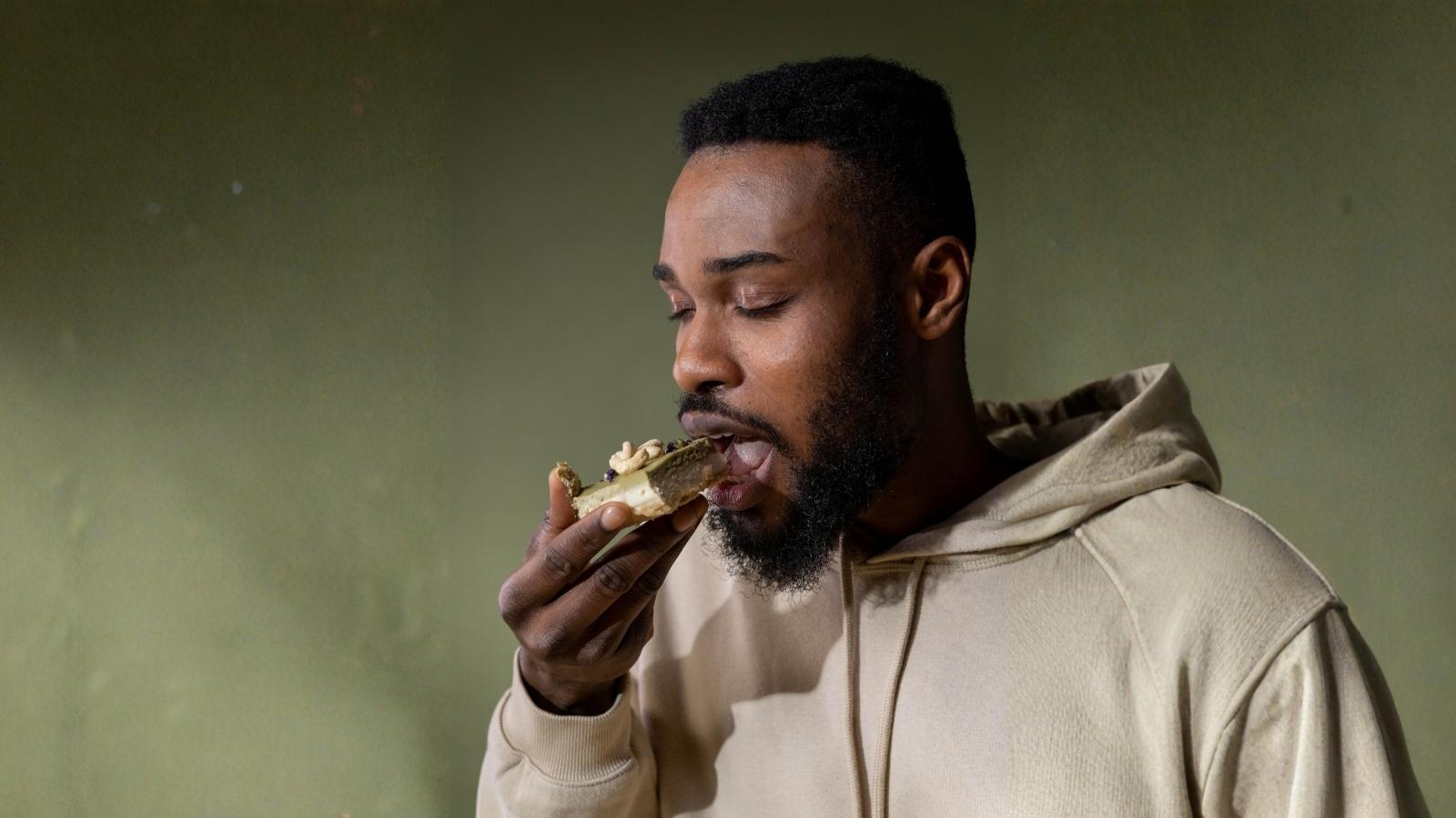 He Took The Last Slice At His Farewell Party—And Somehow Became The Office Villain man eating a slice of cake