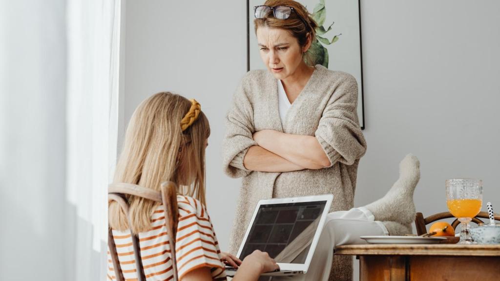 mother scowling at her teenage daughter