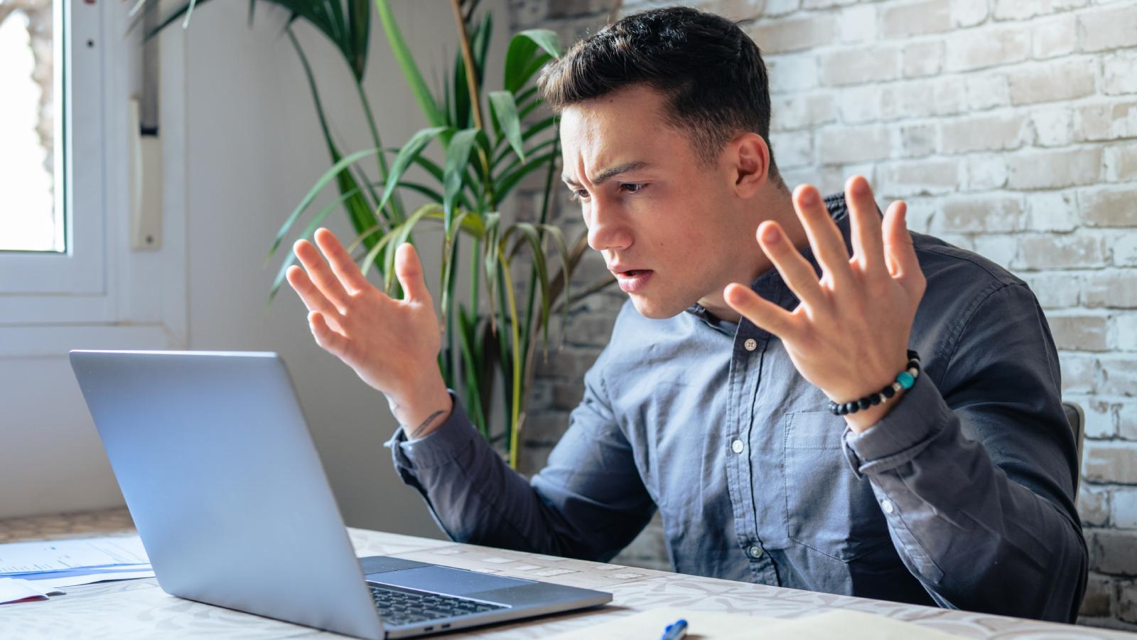 man frustrated at desk