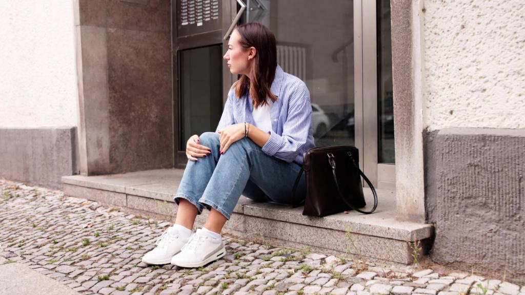 woman sitting on a curb