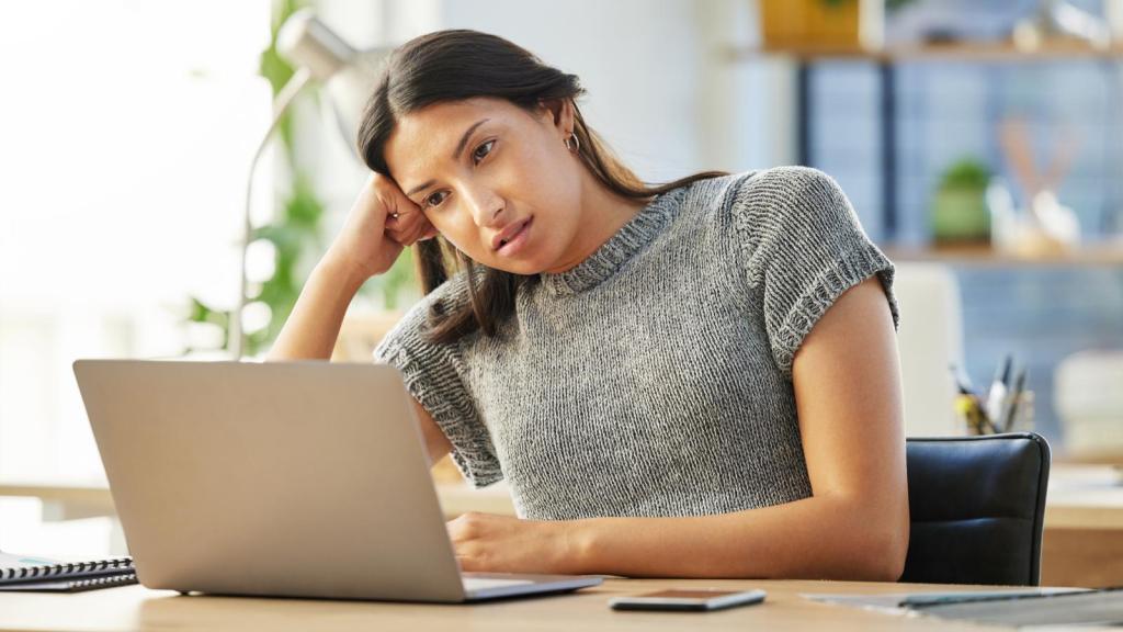 woman looking at her computer