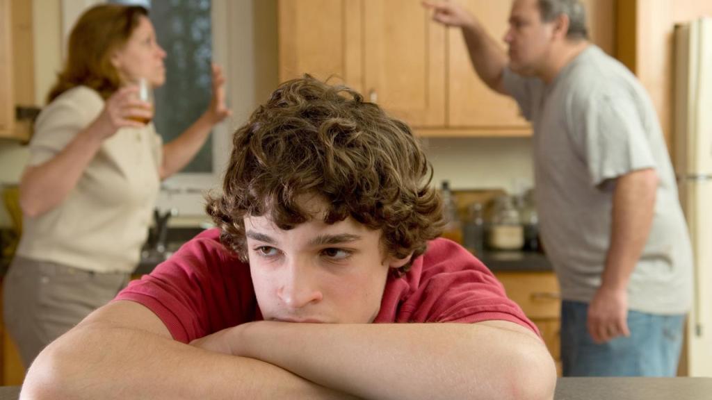 parents arguing with son in background