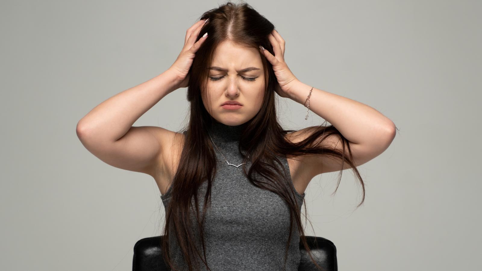 Her Roommates Behavior Is Making College Miserable—And Shes Reached Her Breaking Point woman with her head in her hands