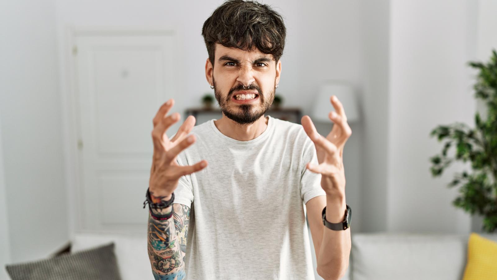 Police and Landlord Refuse to Help as Unemployed Neighbor Blasts Noise Day and Night Just to Provoke Him man with an angry expression