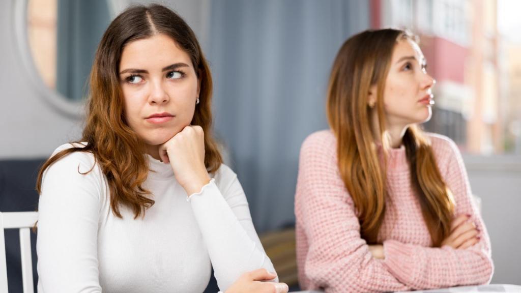two women ignoring each other
