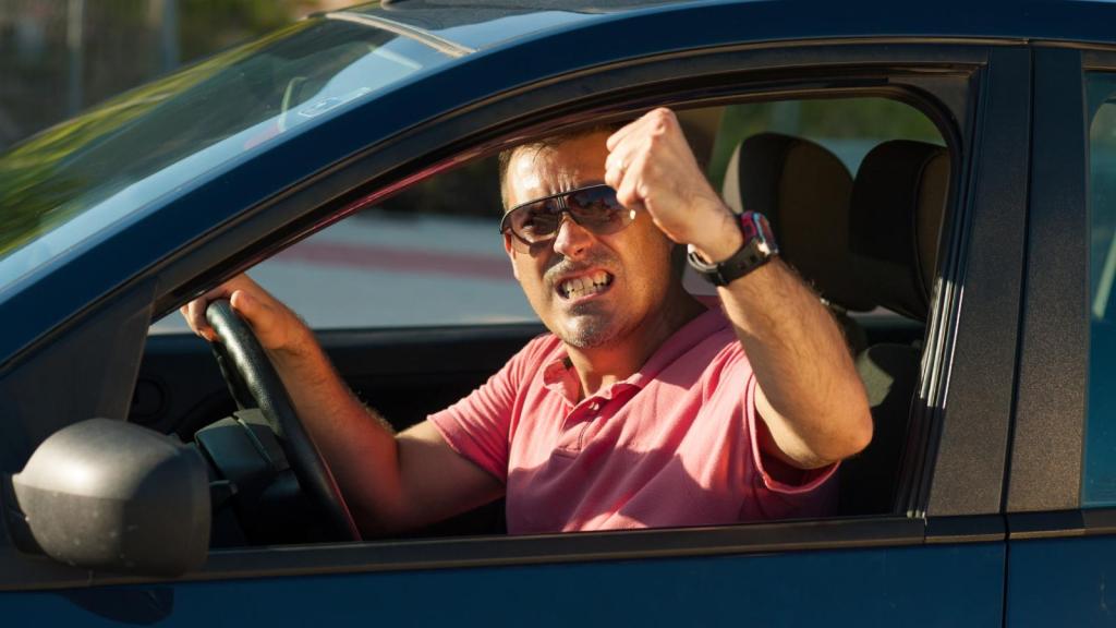 man angry in a car