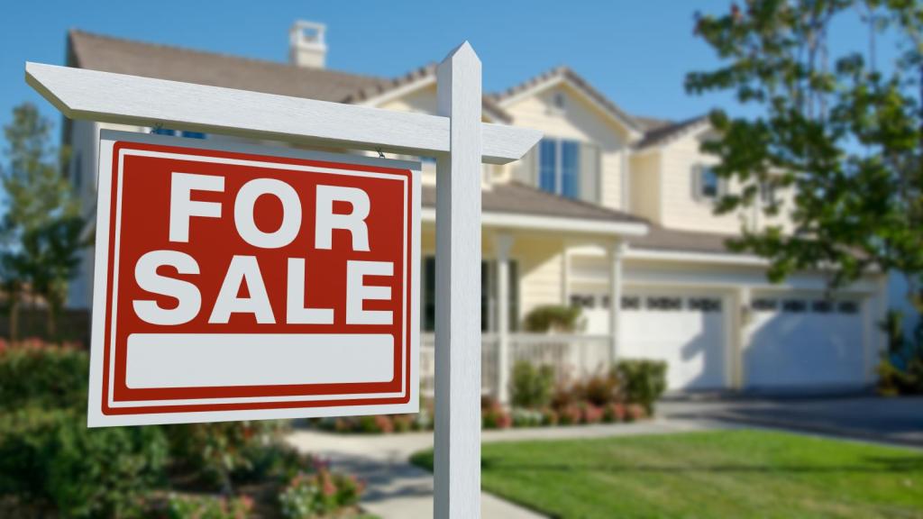 house with a for sale sign