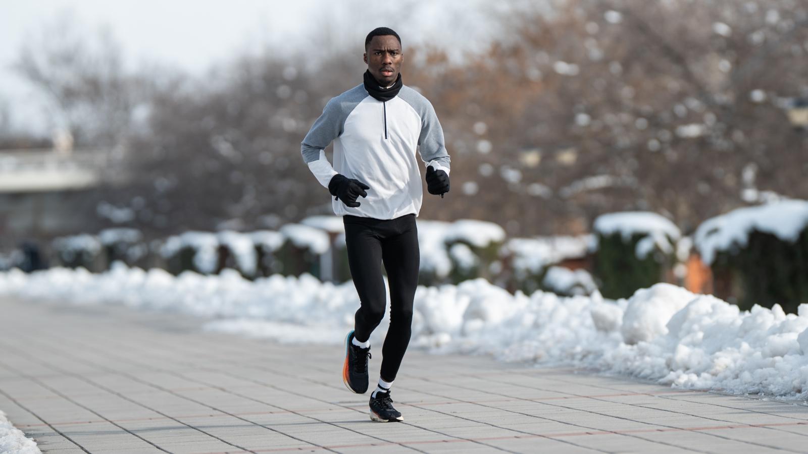 man jogging in the snow