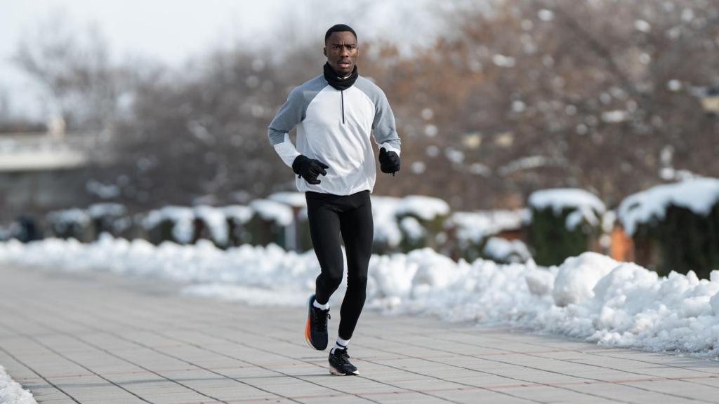man jogging in the snow