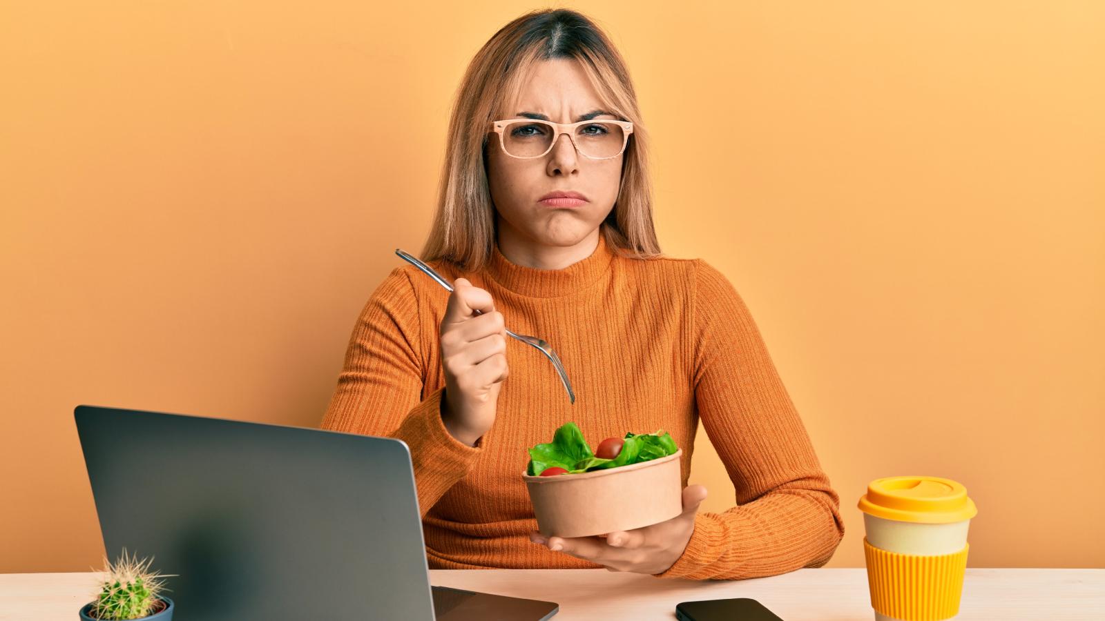 woman eating a salad