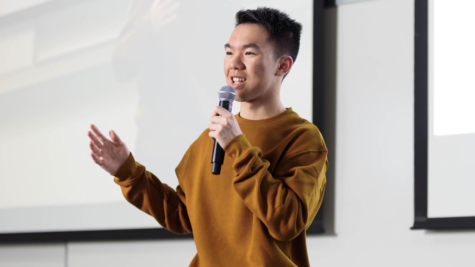 She Targeted Him All Year For No Reason—So He Used His Event Speech to Roast Her Publicly young man giving a speech