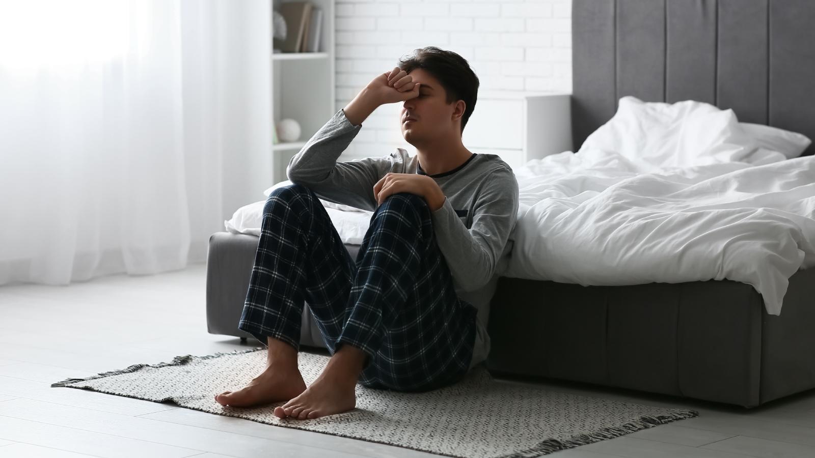 man sitting on a floor