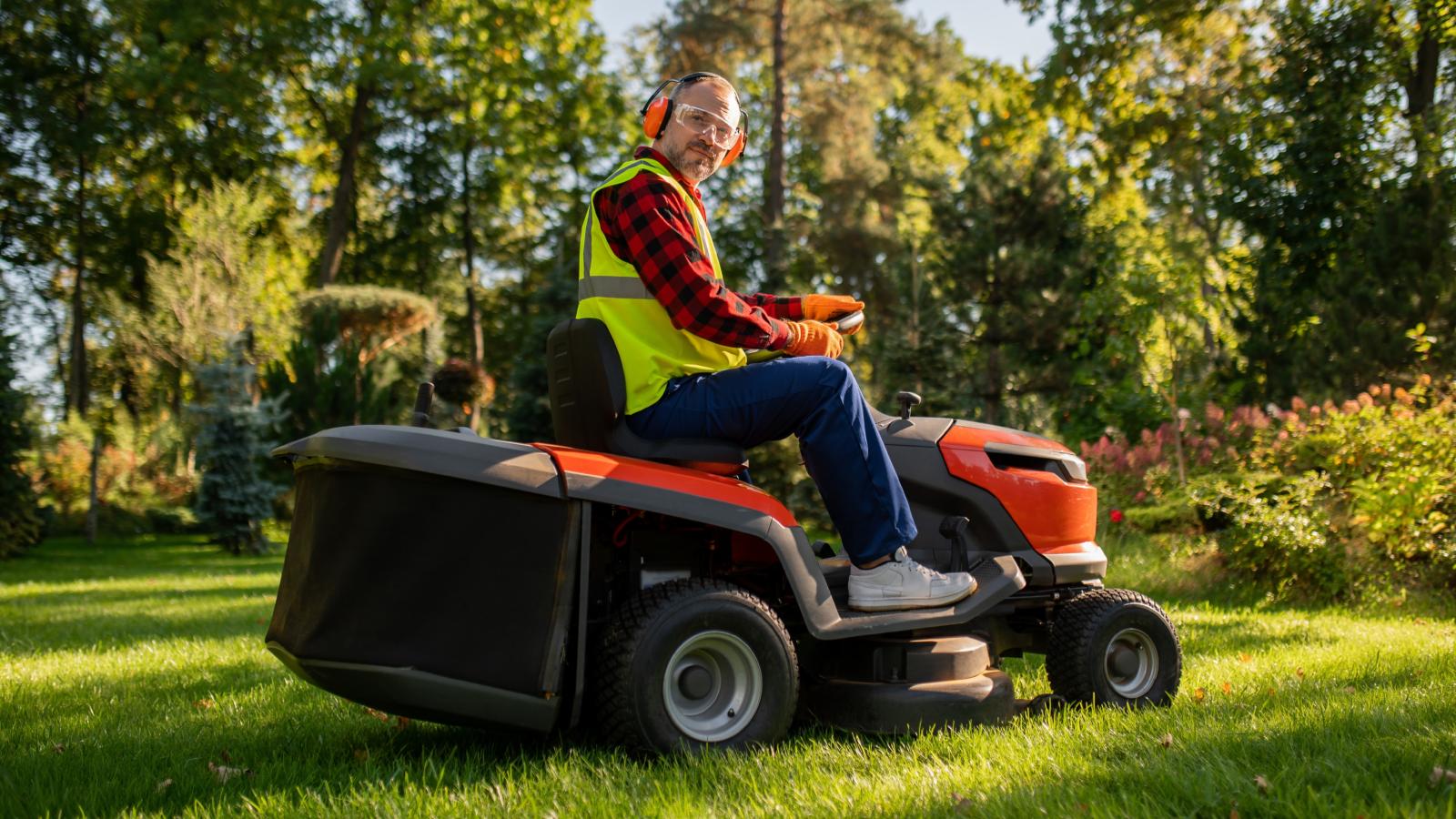 man on a riding lawn mower