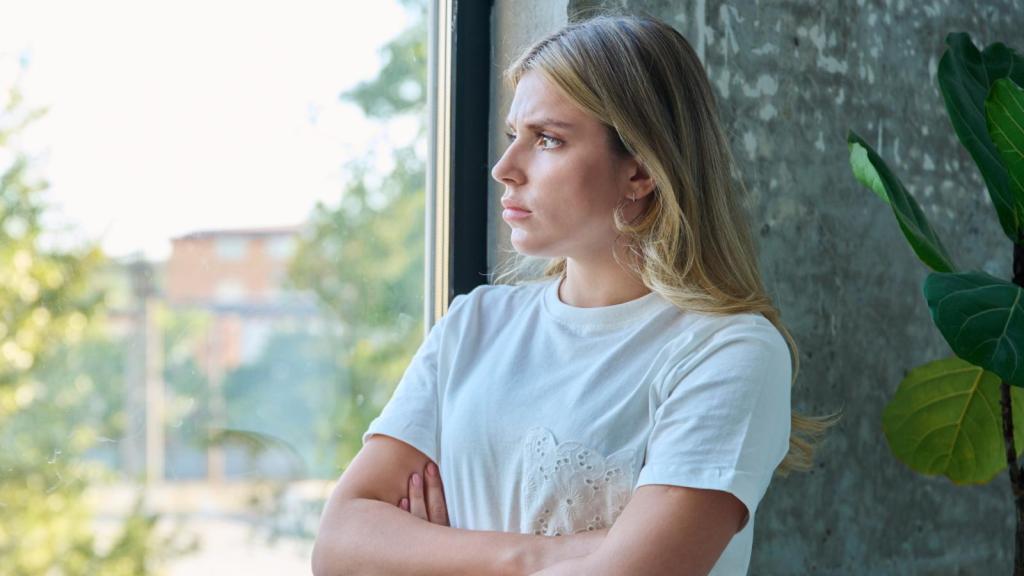 woman looking out a window