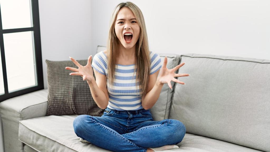 woman screaming on her couch