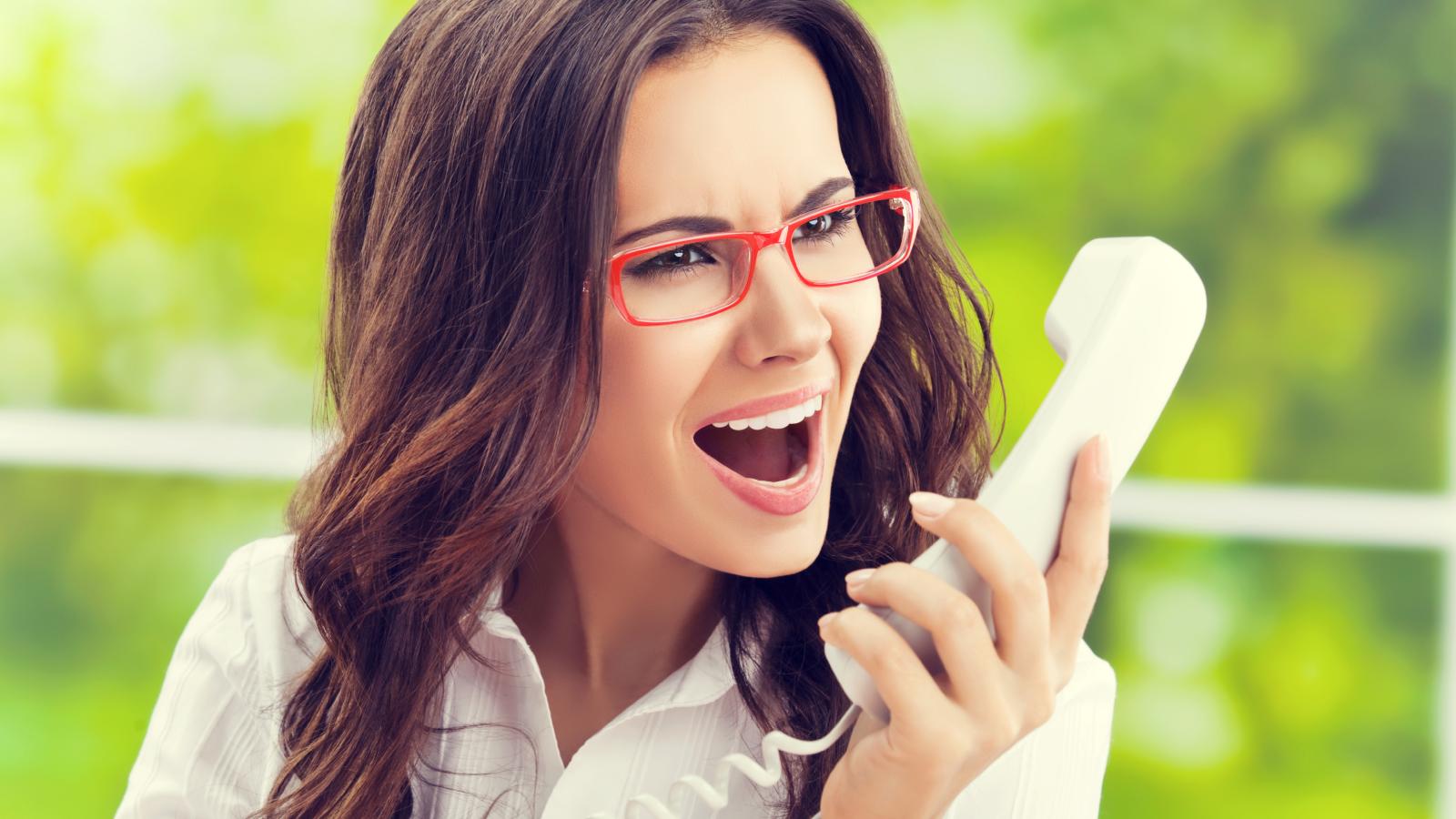 woman yelling into a phone