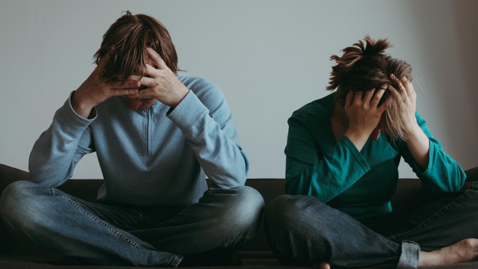 couple stressed out on a couch