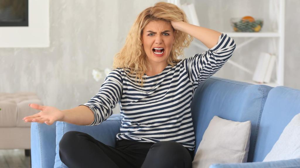 woman upset on a couch
