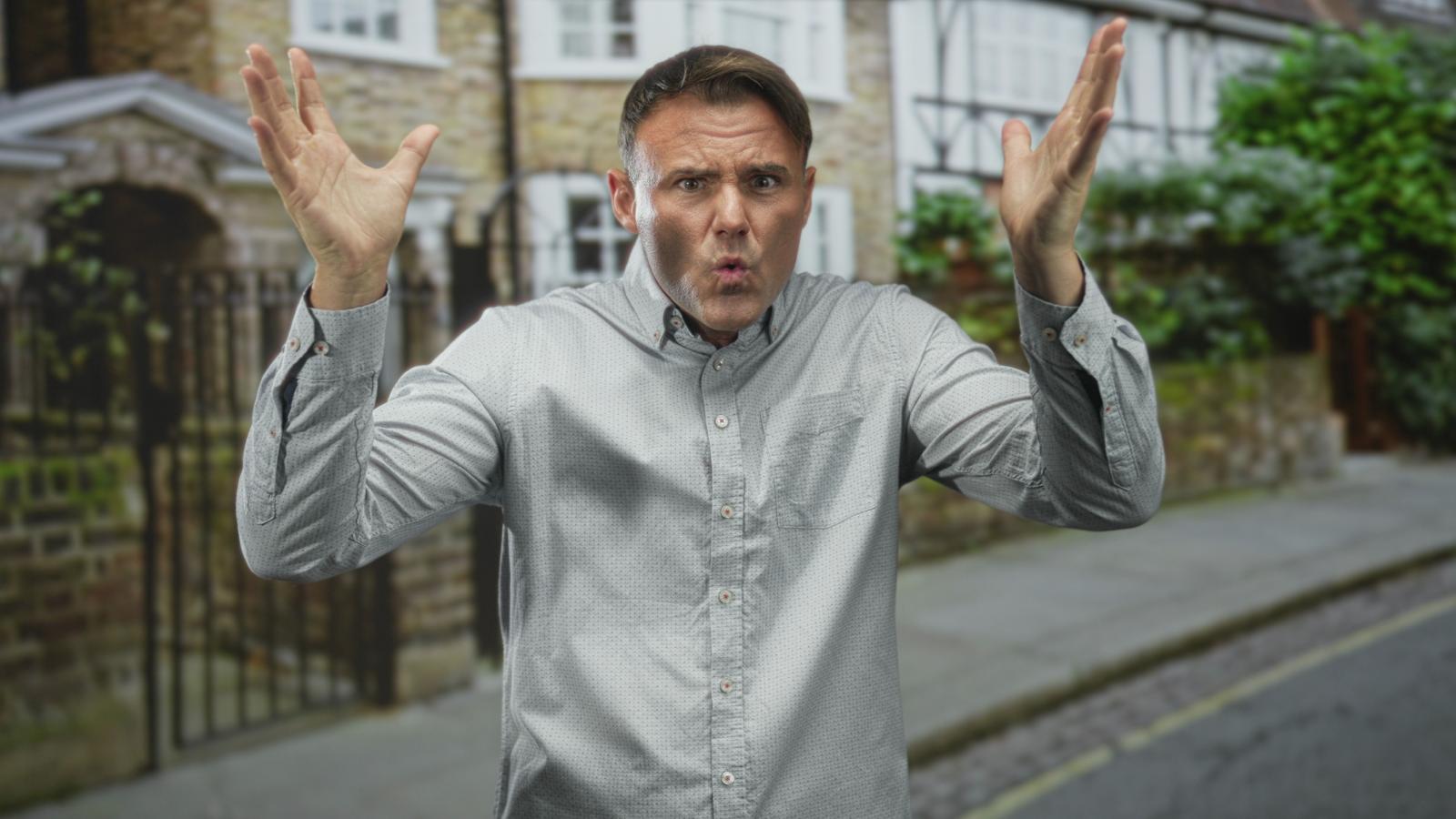 He Moved In Next Door and Brought a 7 Vehicle Fleet. Why One Man’s Public Street Parking Sparked a Suburban War. man shrugging his shoulders