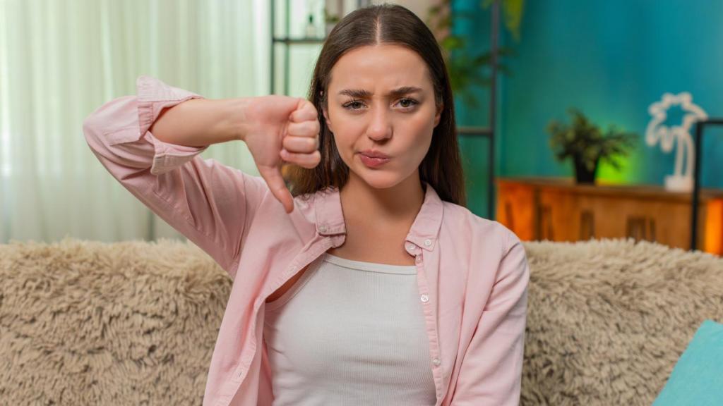 woman giving thumbs down