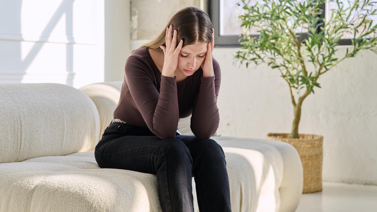 Three Roommates Signed the Lease on Their Dream Apartment—Then the Fourth Backed Out woman holding her head