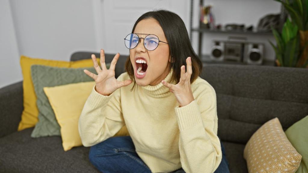 woman yelling on a couch
