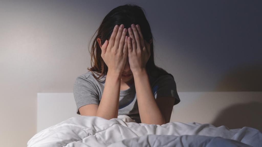 woman covering her eyes