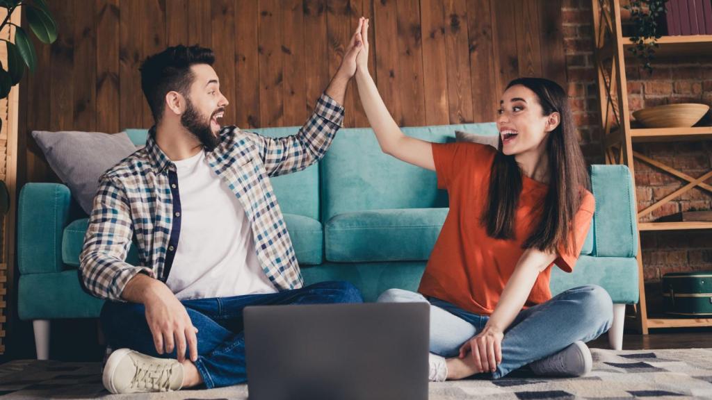 couple high fiving each other