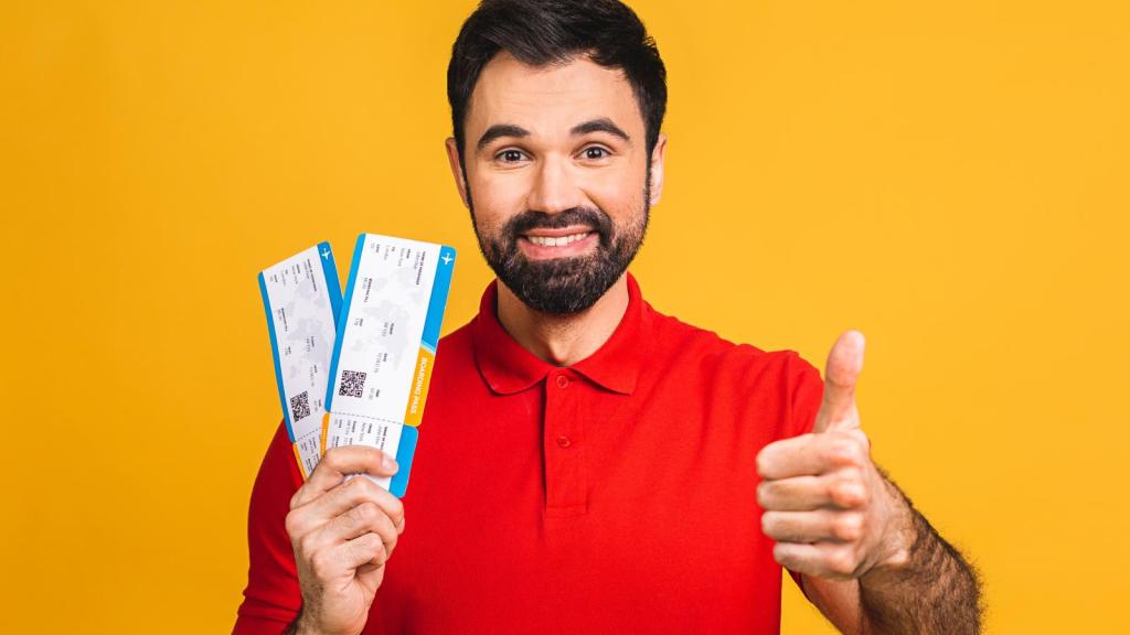 man holding concert tickets