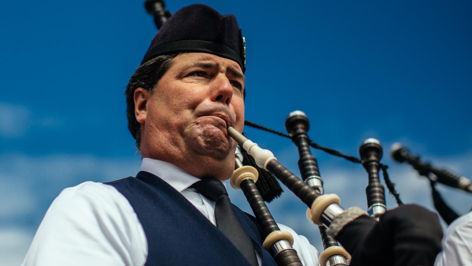 man playing the bagpipes
