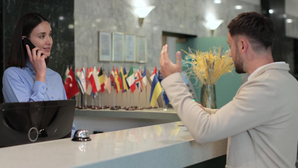 man at a hotel front desk
