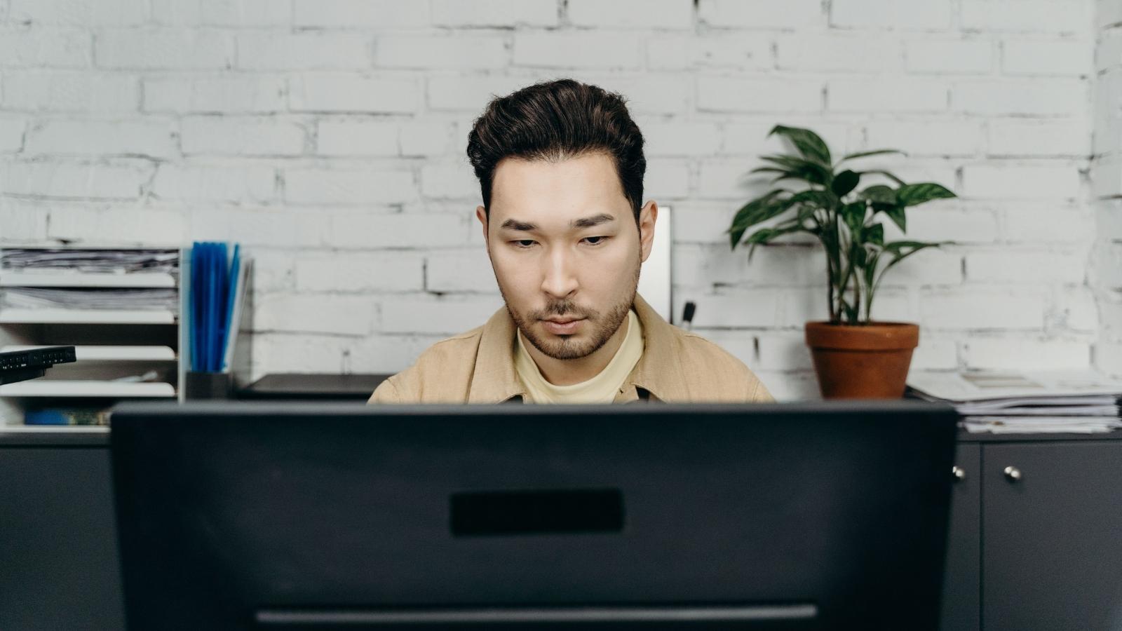 He Optimized His Workflow So Well He Kept Running Out of Work, And His Employers Fired Him for It. Twice. office employee working on his computer