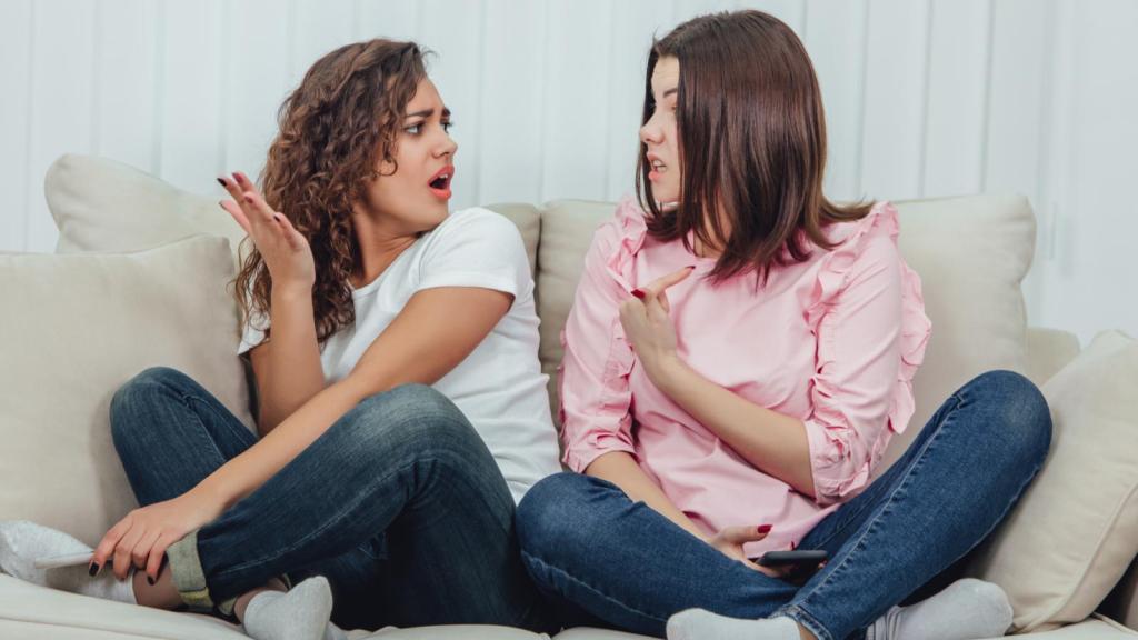 two women on a couch