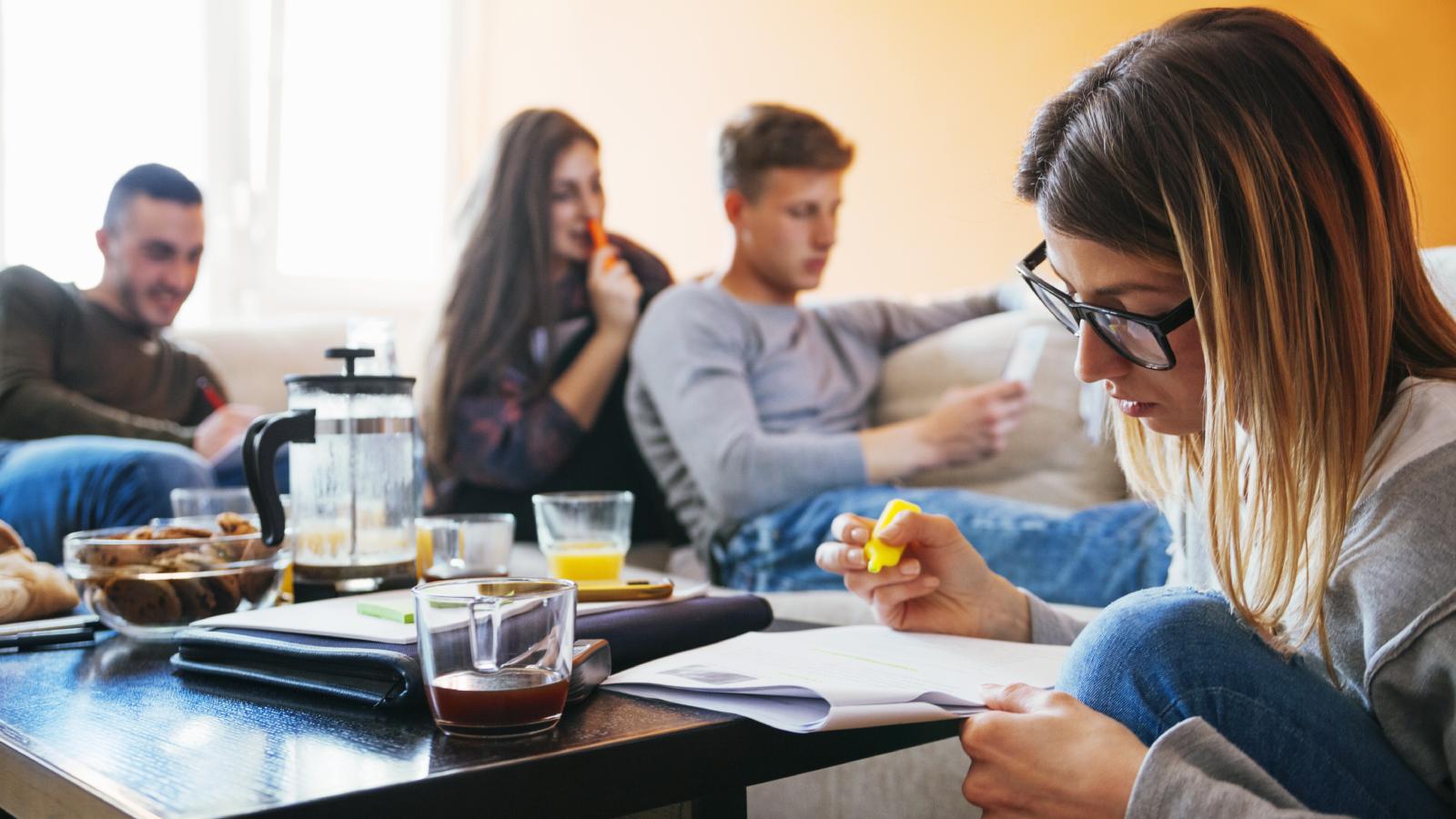 Her Roommate Was Charging People to Use Their Shared Living Room—So She Reported Her to the Landlord people studying in a room