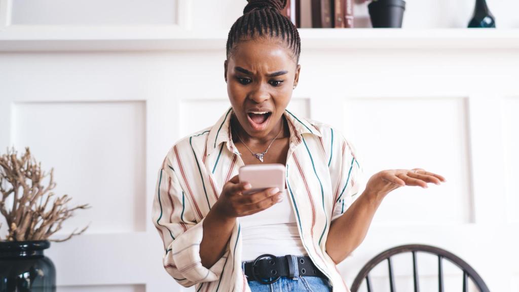 woman looking at her phone