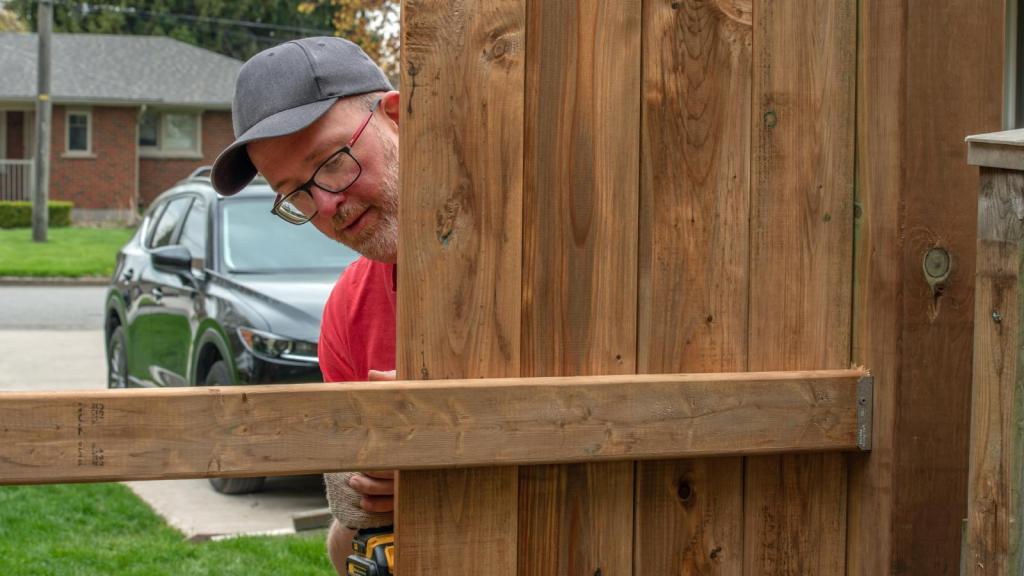 man building a fence