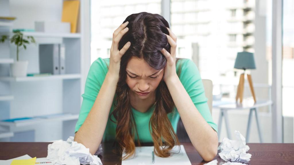 woman with her head in her hands