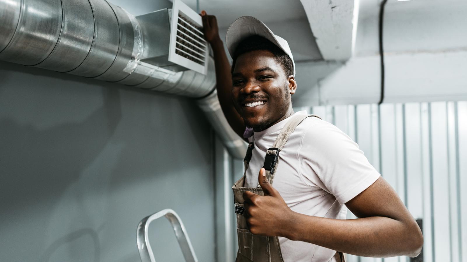 A Homeowner Yelled at His HVAC Tech — The Tech Fixed the Problem and Charged Him the Maximum Price Allowed man working on air vents