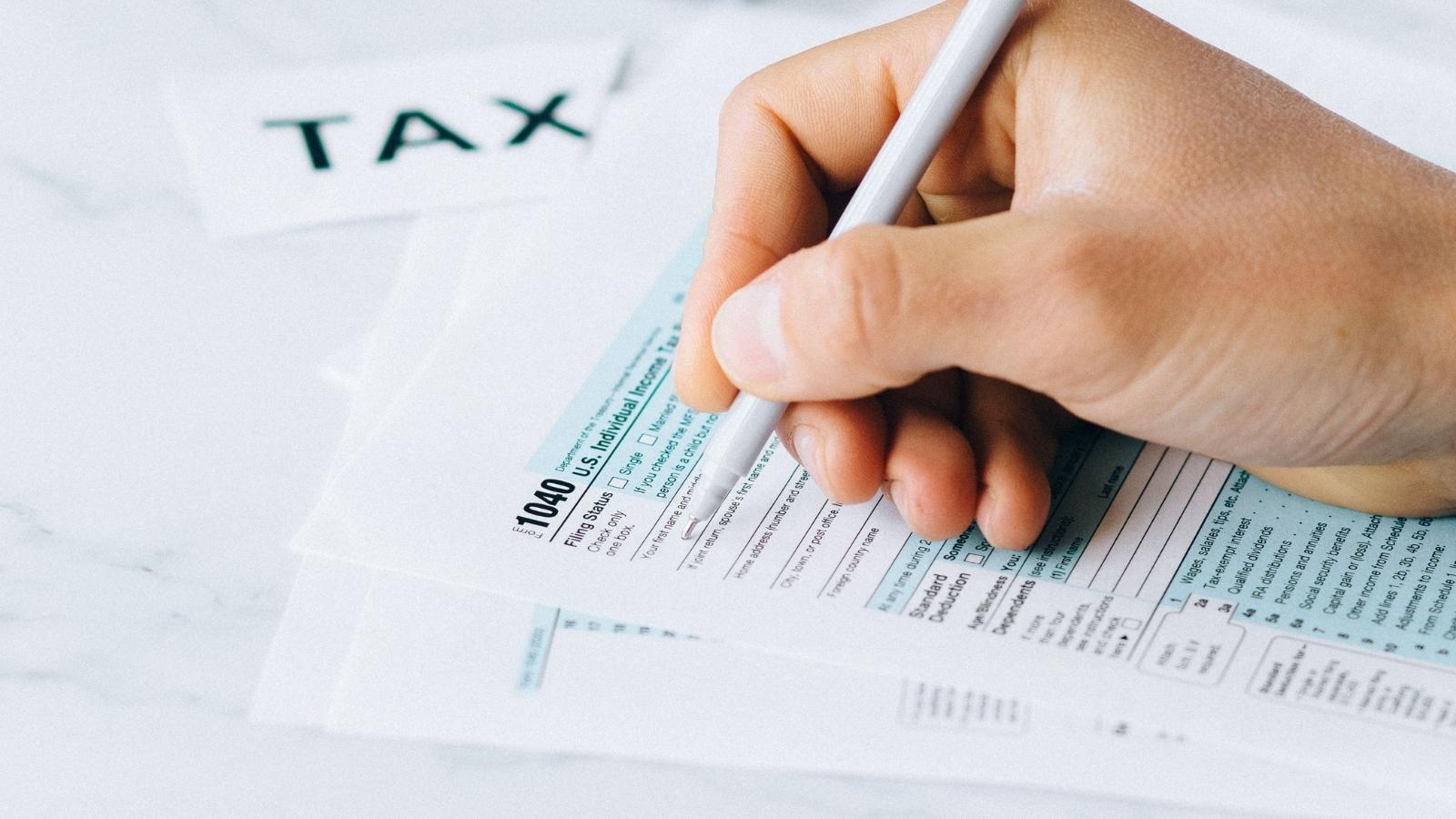 They Guilt Tripped Her to Amend Her Taxes for Their Wallet. When She Said No, She Became the Family Villain. person filing a tax form
