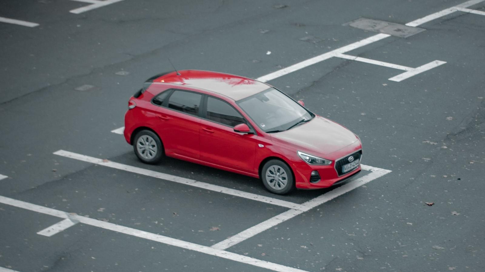 red car parked in a parking space