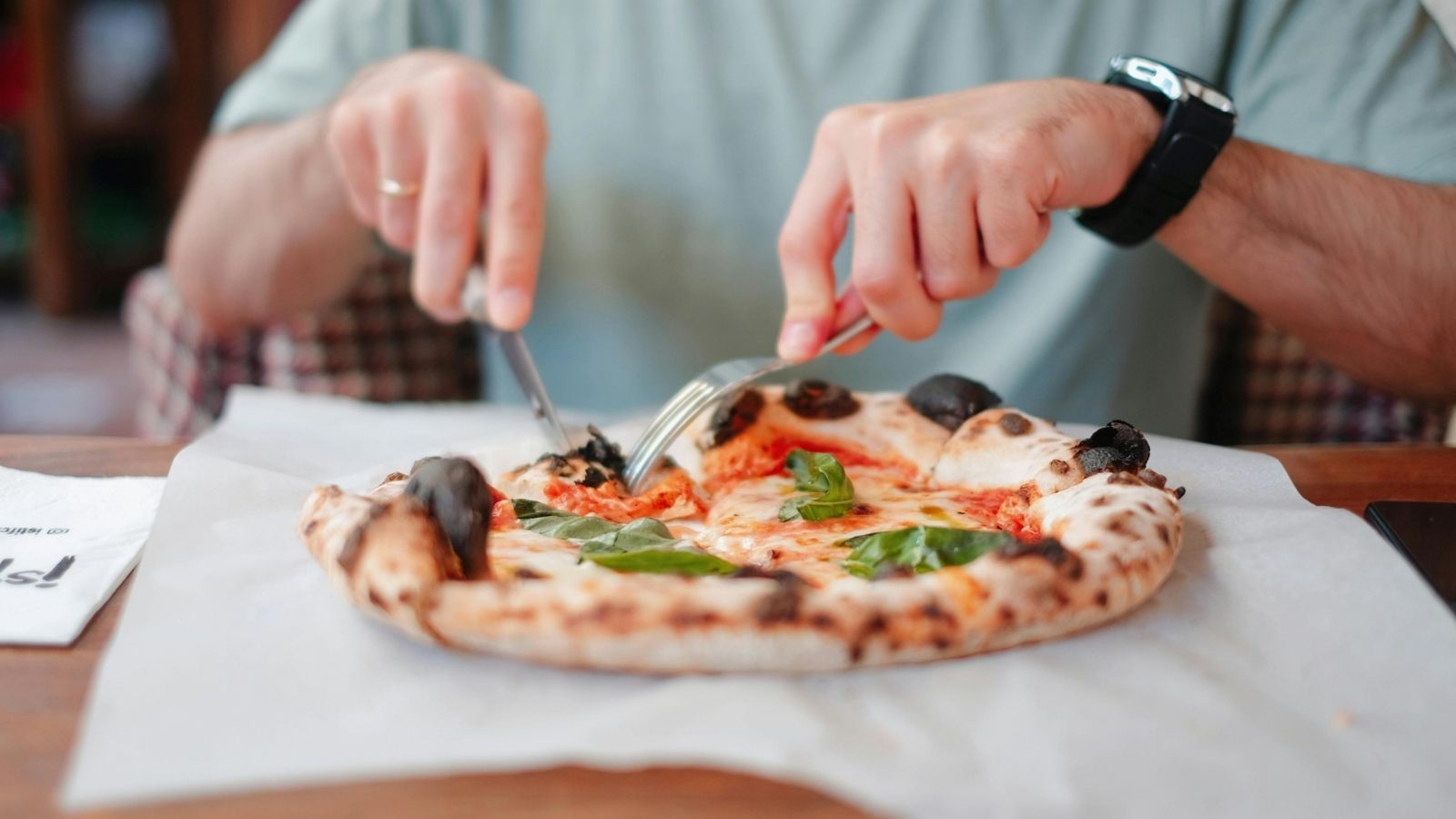 A Mystery Shop Result at a Pizza Store Led to Unexpected Bonus Drama person cutting pizza