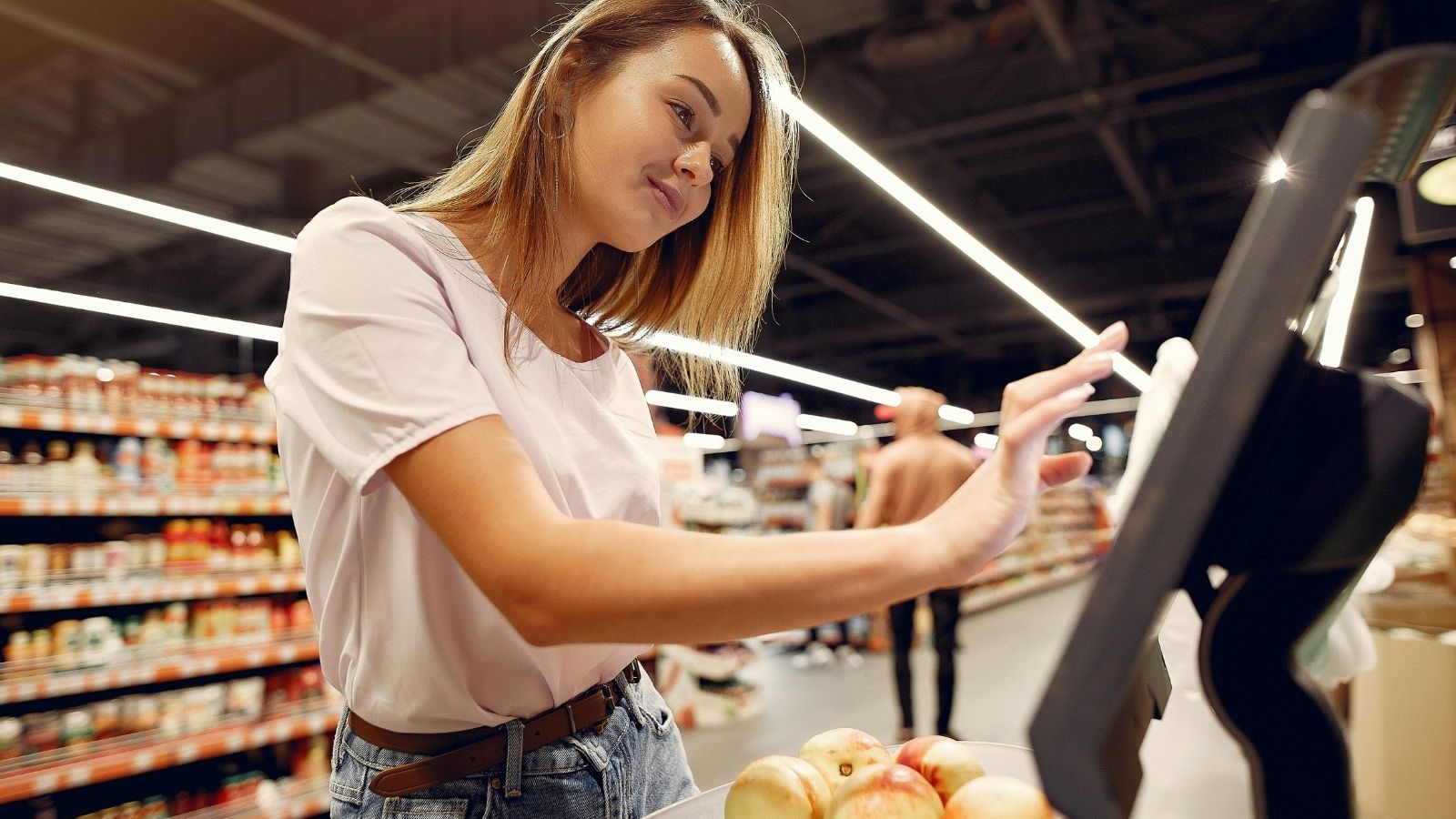 The Assistance Button Feud: How a Self Checkout Notification Triggered a High Stakes Customer Complaint woman at self checkout