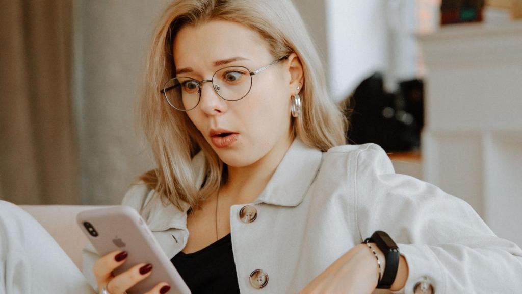 surprised woman looking at her phone