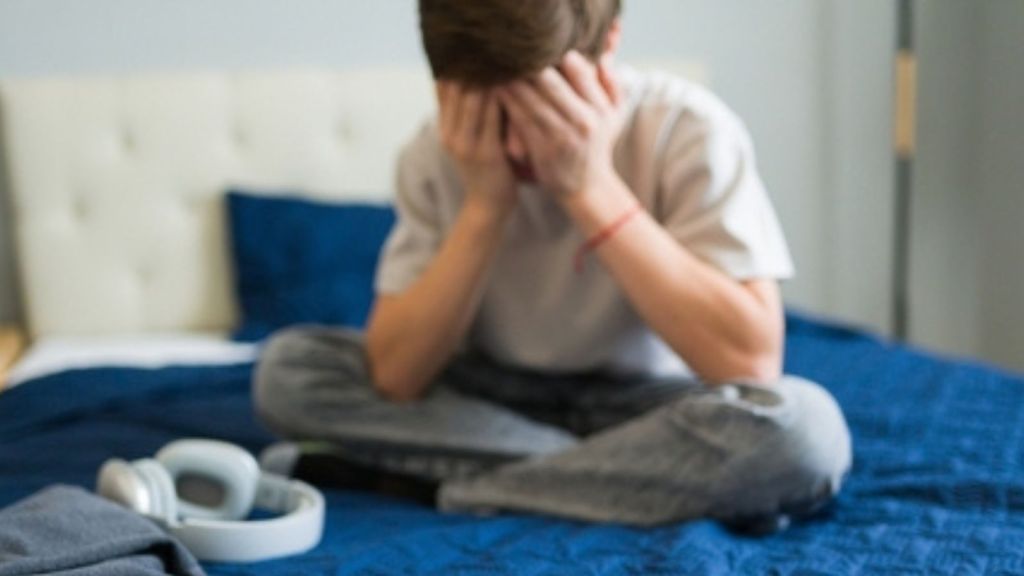 Upset teen boy
